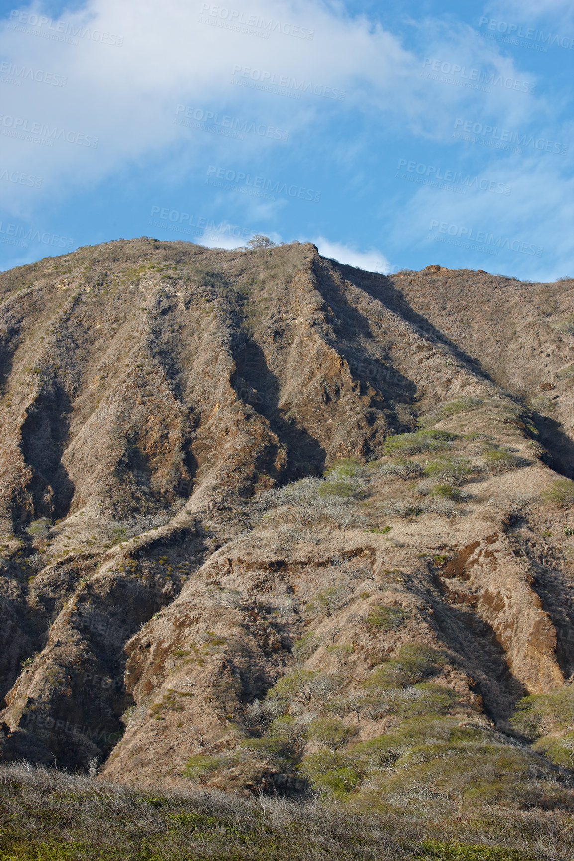 Buy stock photo The Koko Head Volcano in Oahu, Hawaii. An extinct volcano crater up a mountain in summer. A beautiful view of a sightseeing location or landmark outdoors. A natural vacation destination for tourism