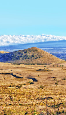 Buy stock photo Volcano landscape, field and blue sky with clouds in countryside for vacation travel and vire. Natural environment, wilderness and hill with grass for ecology, geography and Mauna Loa in Hawaii