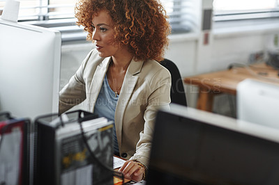 Buy stock photo Cropped shot of a beautiful young businesswoman sitting in her office