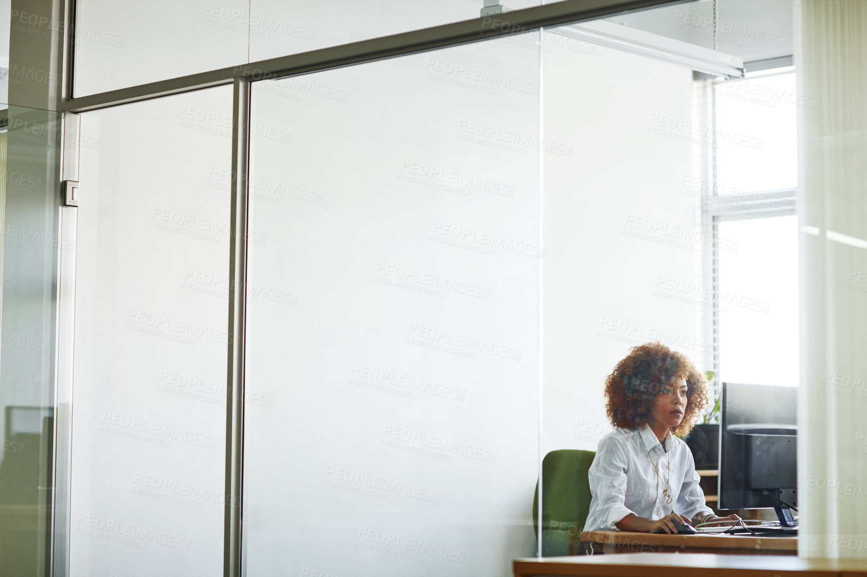 Buy stock photo Cropped shot of a beautiful young businesswoman in her office