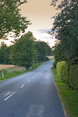 Buy stock photo Road, outdoor and pathway to travel, landscape and peace in environment, location and adventure in forest. Woods, highway and direction of destination for journey, morning and trees on trip or nature