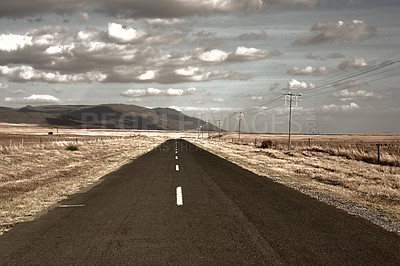 Buy stock photo Street, highway or asphalt in nature for journey, direction and trip to California with grass on landscape. Road, countryside or outdoor path for travel, vacation or holiday with clouds in summer sky