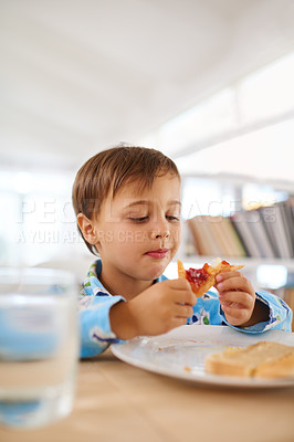 Buy stock photo Breakfast, boy and eating toast at table for nutrition, wellness and sandwich in house. Morning, food and water for meal at home with bread, glass and kid inside for snack, healthy and vitality