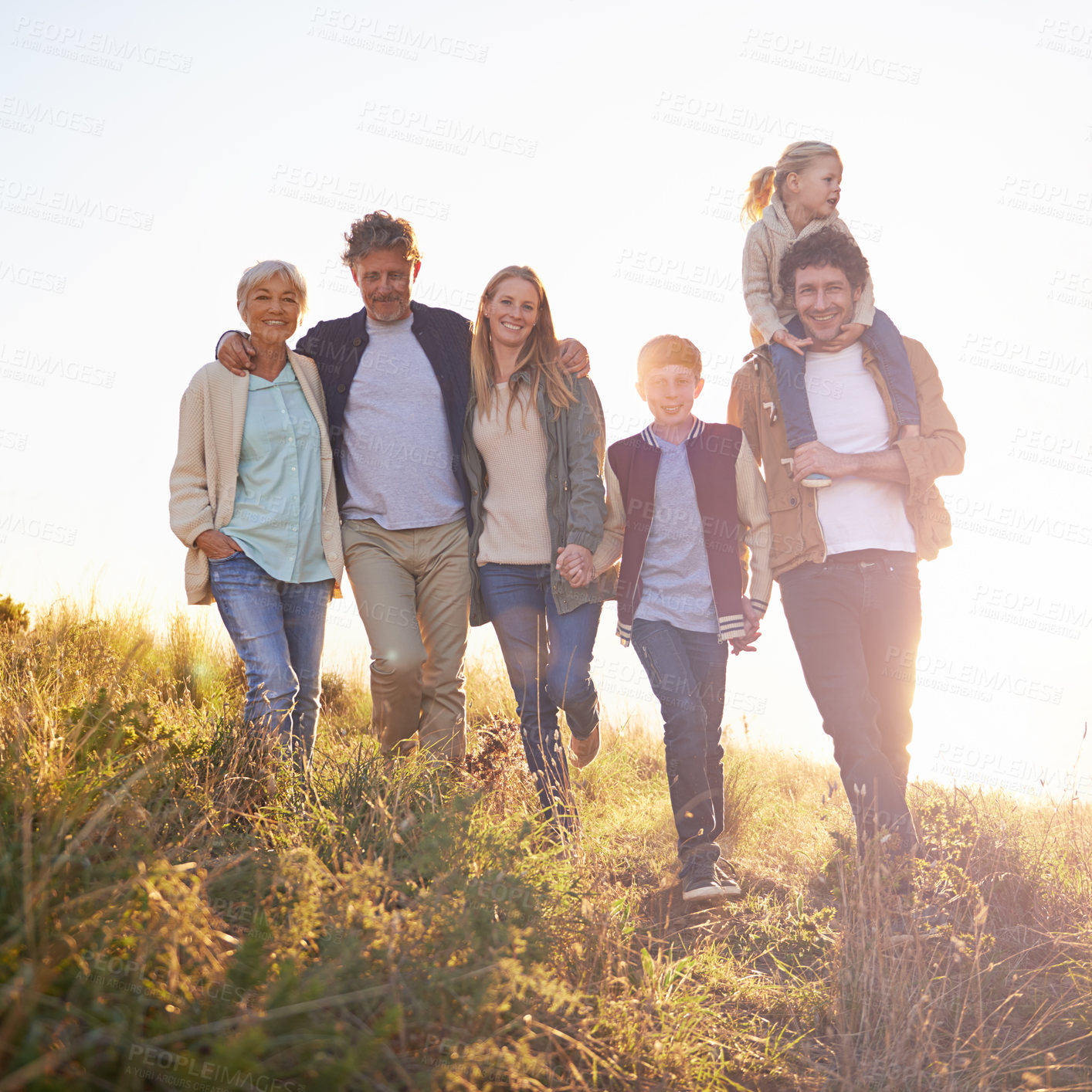 Buy stock photo Full length portrait of a happy multi-generational family on an afternoon walk