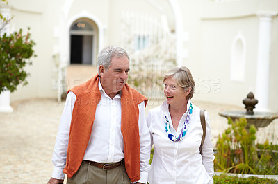 Buy stock photo Walking, talking and a senior couple in the city for a retirement holiday, travel and happiness. Smile, love and an elderly man and woman on a walk in an old town or hotel during a vacation together