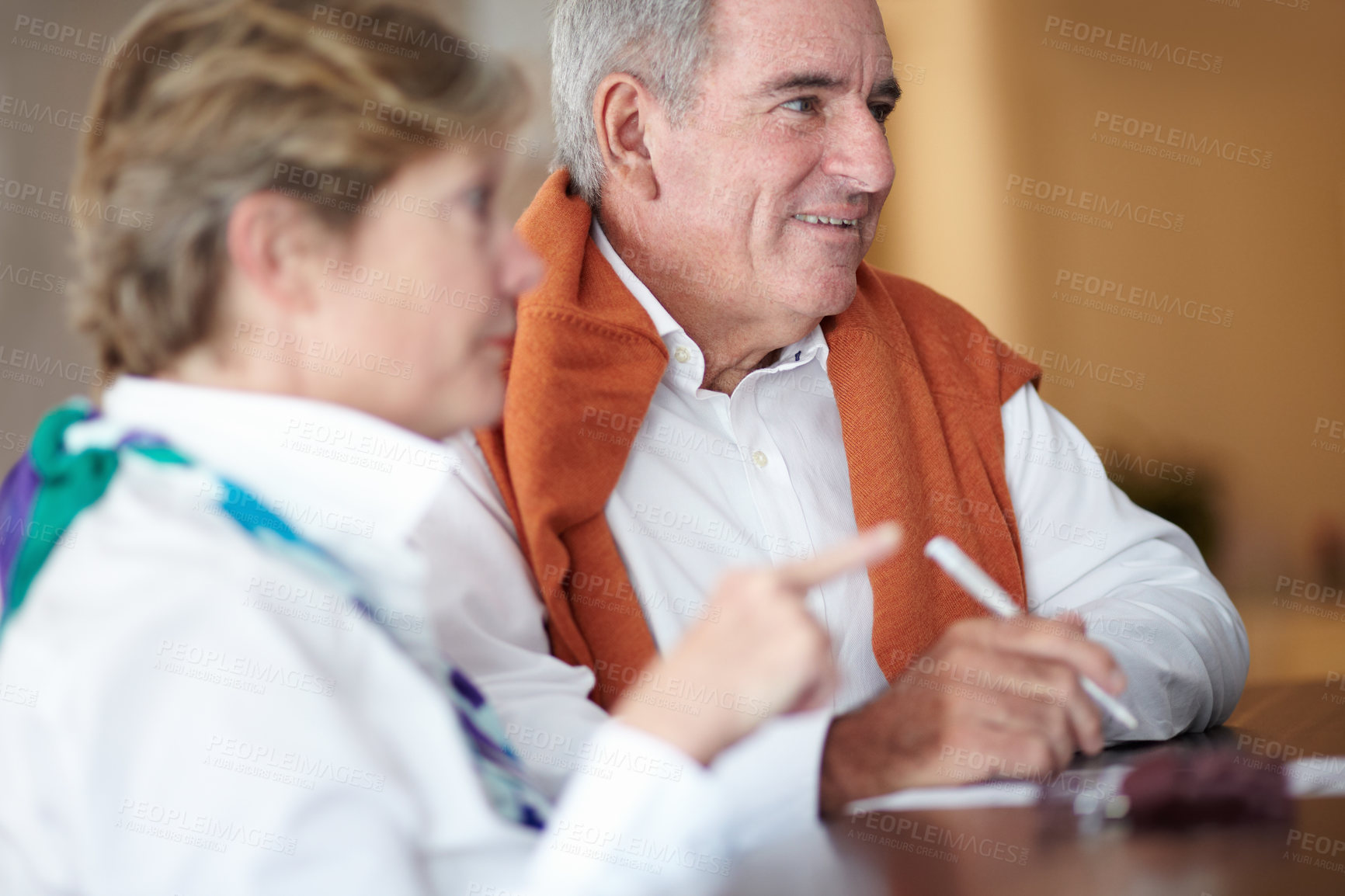 Buy stock photo Sign, hotel and senior couple by reception to check in desk for travel, anniversary and relax. Retirement, hospitality resort and elderly man and woman with concierge for bonding, holiday or vacation