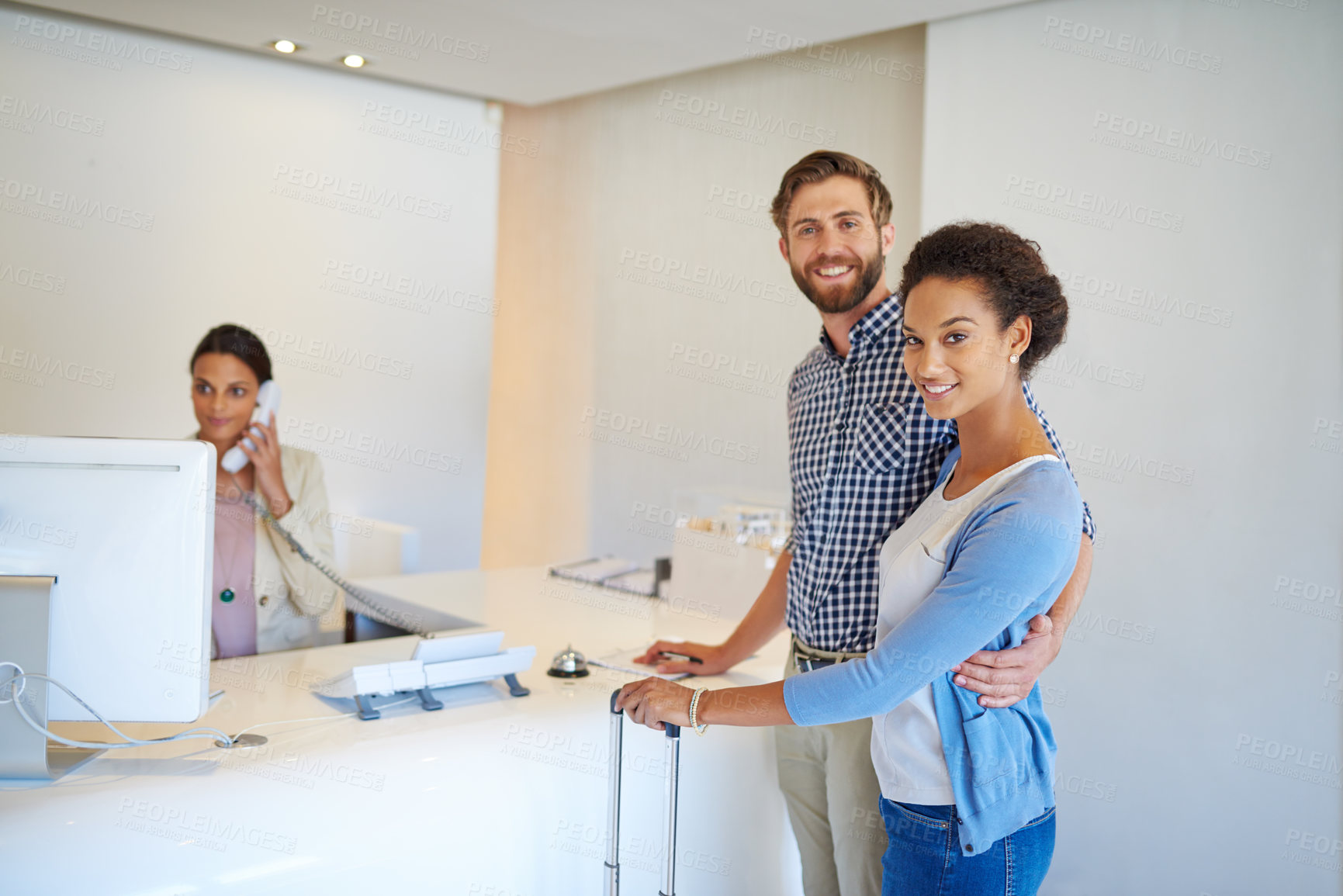 Buy stock photo Receptionist, couple and portrait for sign in, welcome and help desk with friendly service. Happy man, woman and people with luggage, hospitality or holiday for hotel or lodge vacation with suitcase