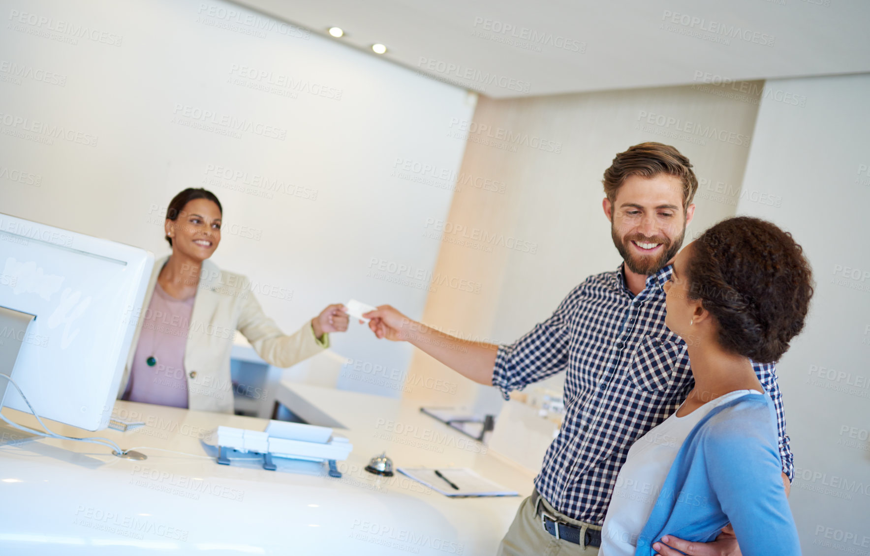 Buy stock photo Reception desk, couple and card for check in, welcome and help with friendly service. Happy man, woman and people with smile, hospitality or holiday for reception or lodge vacation with room key