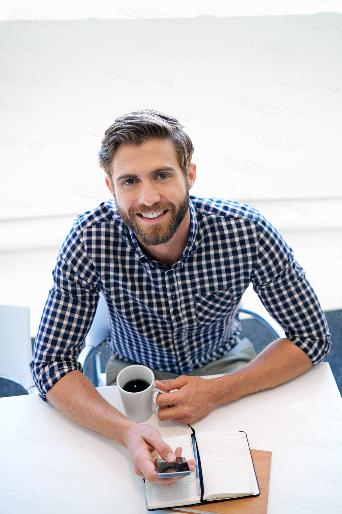 Buy stock photo Happy, businessman and smartphone with notebook at office for email notification, social media and post on break. Above, male person and smile on portrait with coffee for communication and networking