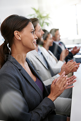 Buy stock photo Shot a group of businesspeople applauding a business presentation