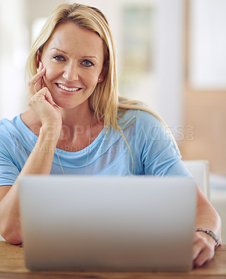 Buy stock photo Portrait of a mature woman using a laptop at home