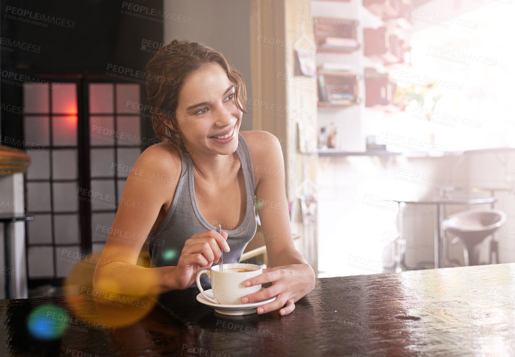 Buy stock photo Cropped shot of a young woman drinking coffee at a cafe