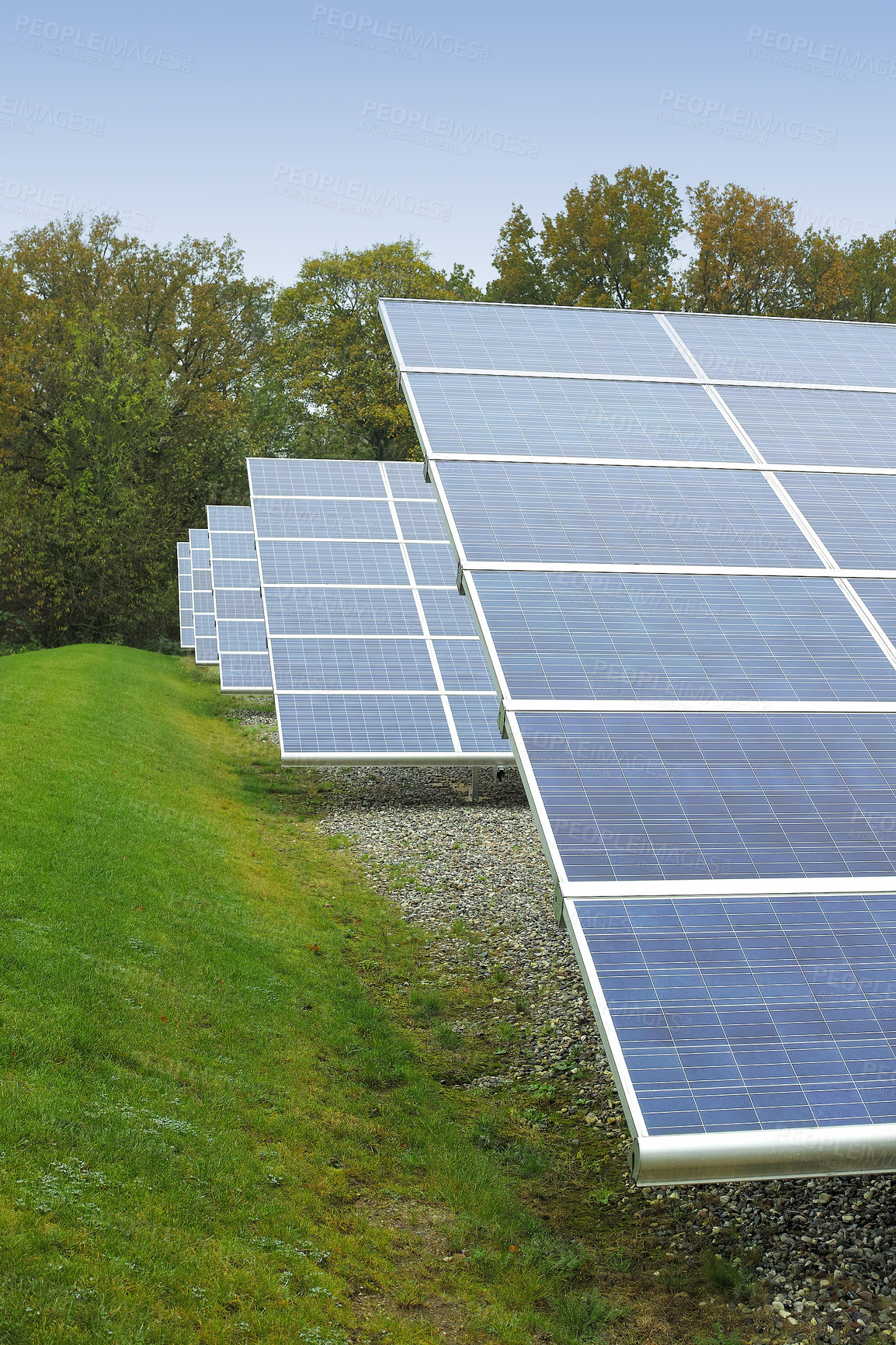 Buy stock photo Solar power installation in Denmark. Photovoltaic solar cell panels as renewable energy source. Blue solar panels generating electricity in solar power station, alternative energy from nature