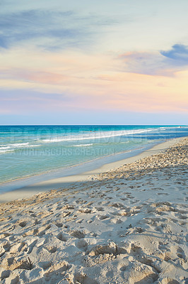 Buy stock photo Sunset, ocean and footprints in sand for travel, vacation or holiday in summer by coastal island. Walk imprint, steps and sea waves on LaniKai beach for tropical weekend trip at destination in Hawaii