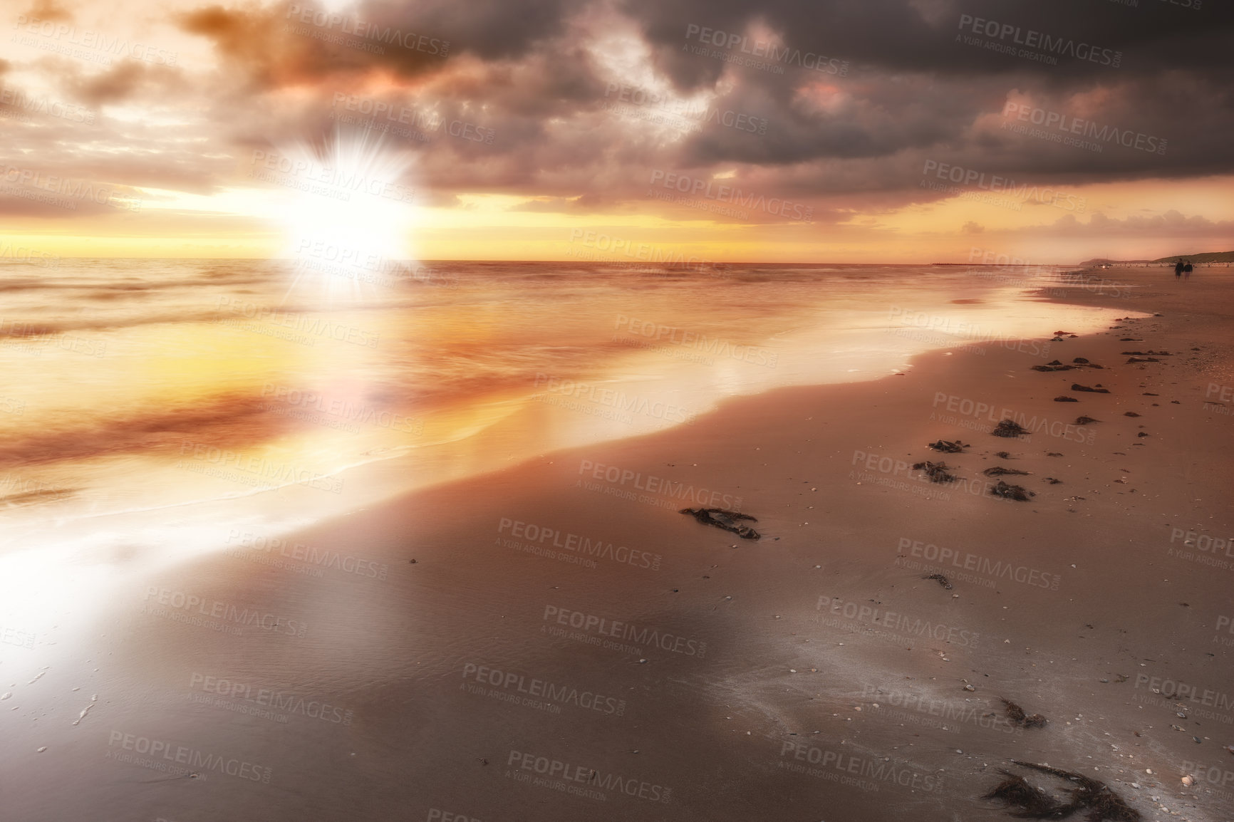 Buy stock photo Sunset, beach and sea for vacation, holiday and travel to Denmark in summer. Ocean, lens flare and sand on coast with sky, nature or clouds on horizon with calm waves on landscape outdoor in Jutland