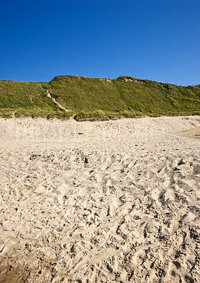 Buy stock photo Beach, blue sky and outdoor with hill on horizon, nature and  background for vacation, summer and travel. Ground, sand and landscape for holiday, paradise and environment in Jutland, Denmark