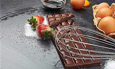 Buy stock photo Restaurant, baking ingredients or chocolate with eggs, flour and strawberry with sugar on table in kitchen. Fruit, background or cooking products on counter for meal, food recipe or dessert for diet