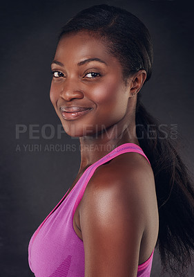 Buy stock photo Studio shot of a beautiful young woman ready for a workout against a black background