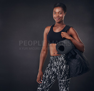 Buy stock photo Studio shot of a beautiful young woman ready for a workout against a black background