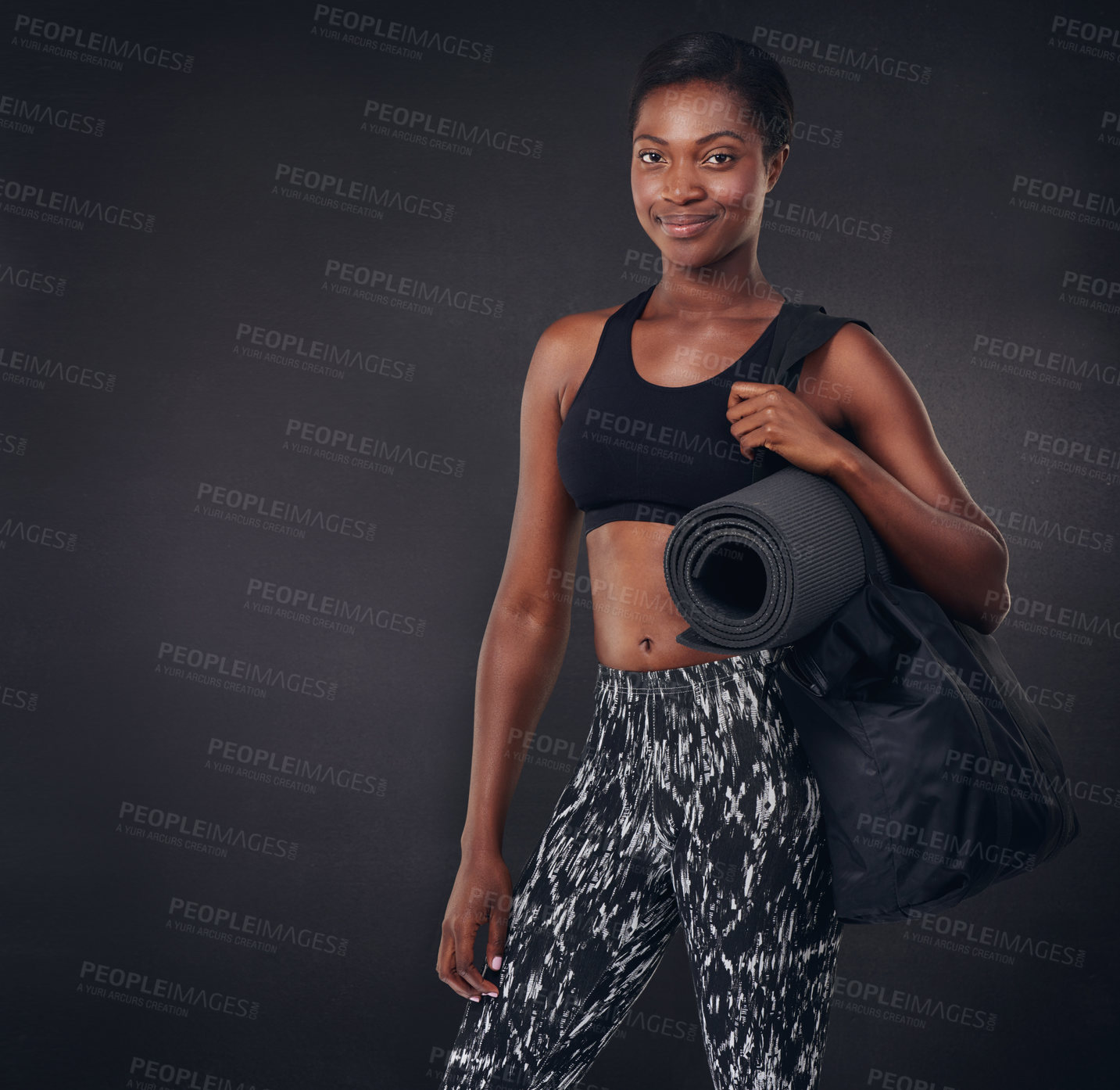 Buy stock photo Studio shot of a beautiful young woman ready for a workout against a black background