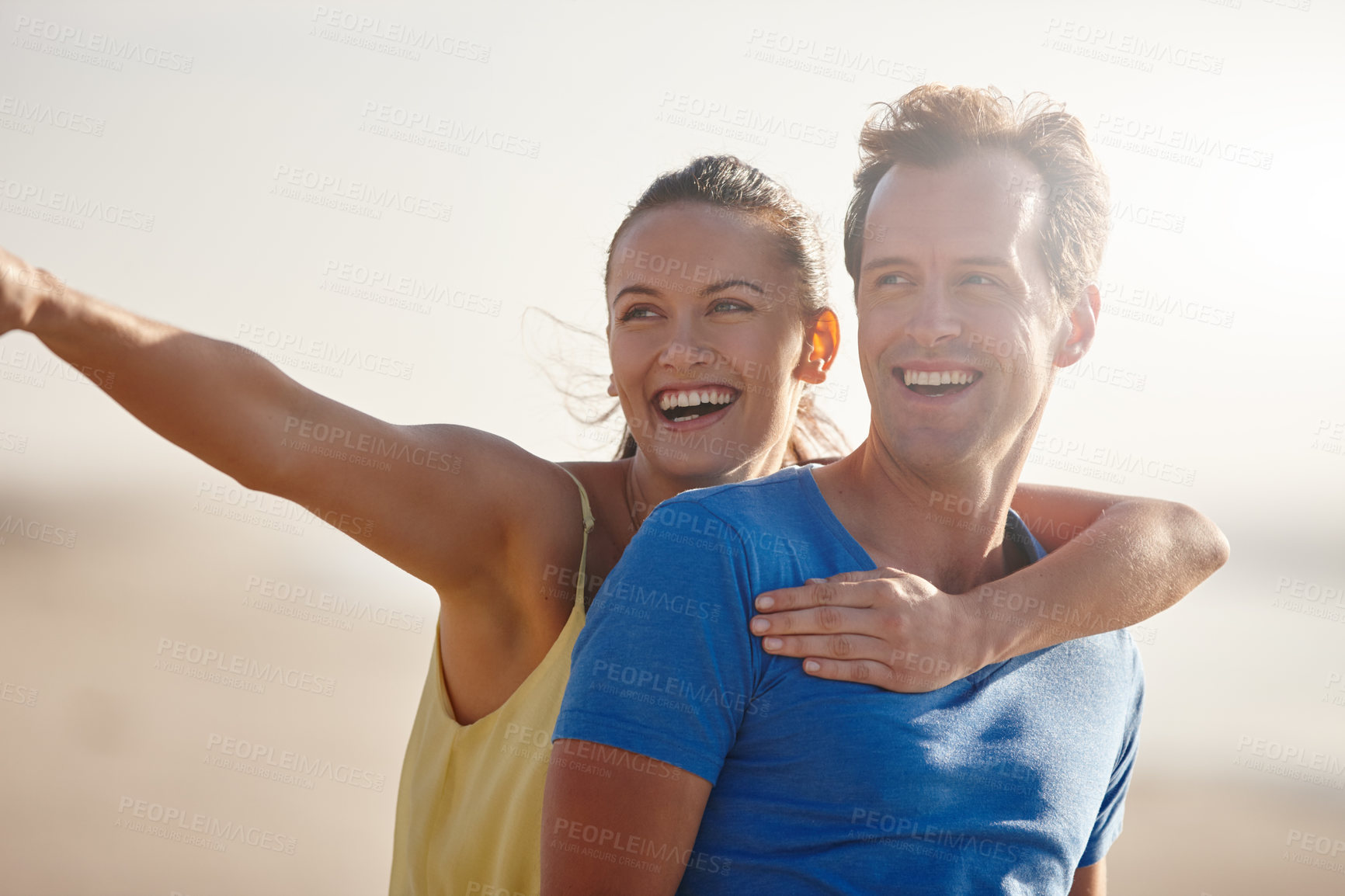 Buy stock photo Shot of an affectionate couple on the beach