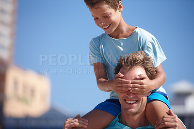 Buy stock photo Shot of a father and son playing and having fun outdoors
