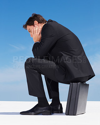 Buy stock photo Depression, sky or professional man sad, burnout or stress over lawyer mistake, company disaster or corporate fail. Mental health risk, bankruptcy anxiety or overwhelmed attorney sitting on suitcase 