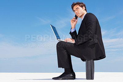 Buy stock photo Laptop, phone call and business man on briefcase in conversation, listening or communication on blue sky mockup space. Computer, mobile chat and serious lawyer networking, discussion or legal advice