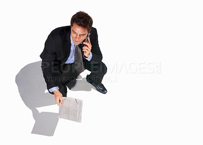 Buy stock photo Business, phone call and man in studio with newspaper, networking or communication with top view floor mockup. Travel, smartphone or above male journalist with paper, article or contact us newsletter