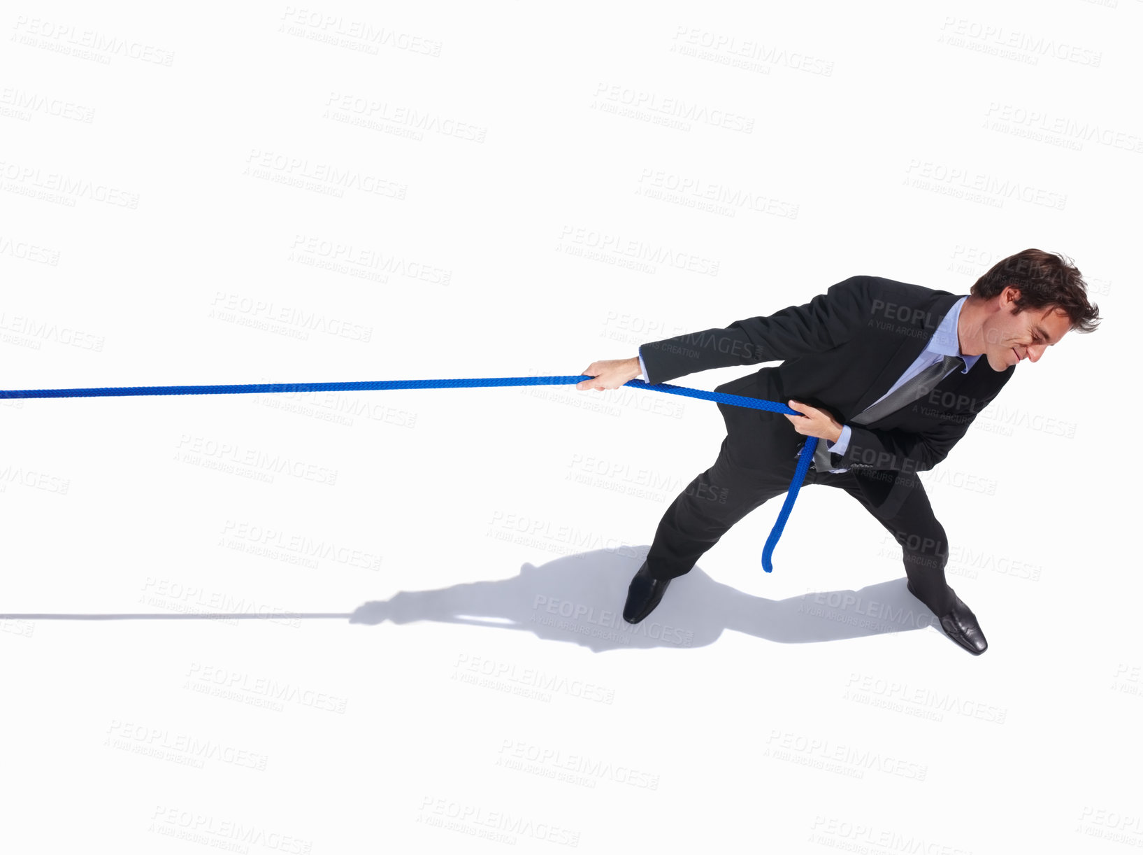Buy stock photo Businessman, frustrated and tug of war by white background, career challenge and industry competition. Young person, mental health and professional worker with rope, top view and job battle in studio