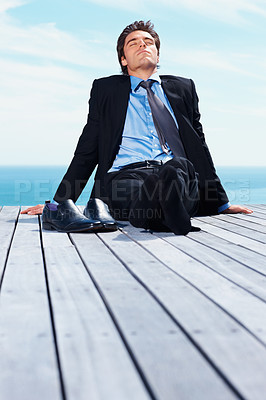 Buy stock photo Business man, outdoor and relax on vacation of a corporate professional on holiday with peace on deck. Worker, male employee and suit by sea with calm and blue sky with job and career by ocean