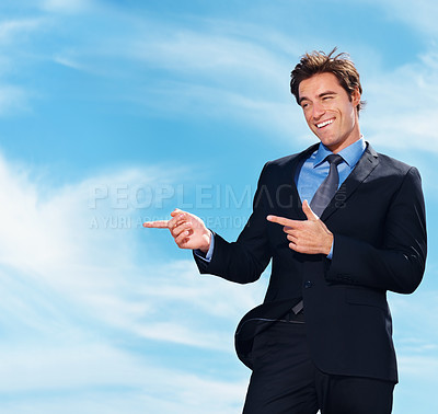 Buy stock photo Happy, blue sky and business man point at corporate announcement, company promotion or legal information. Commercial, outdoor freedom and professional lawyer, attorney or advocate advertising news 