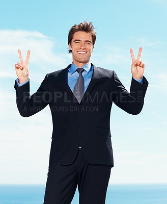 Buy stock photo Portrait, smile and peace sign with a business man outdoor on a blue sky background for success or motivation. Corporate, professional and hand gesture with a happy young employee in a formal suit