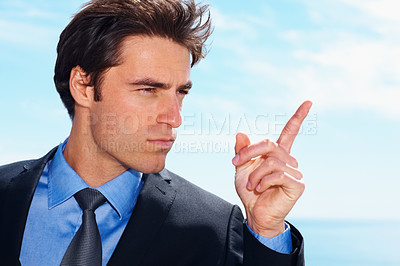 Buy stock photo Face, pointing and a business man on a blue sky background planning with a vision for the future. Thinking, idea or inspiration and a confident young employee in a suit with a mindset for growth