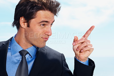 Buy stock photo Face, pointing and a corporate man on a blue sky background planning with a vision for the future. Business, thinking or idea and a confident young employee in a suit with a mindset for growth