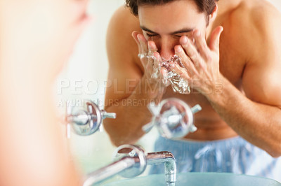 Buy stock photo Man, face and water for rinsing in bathroom for germs, bacteria and facial hygiene. Male person, hands and sink for dermatology, skincare or morning routine with soap for grooming, health or wellness