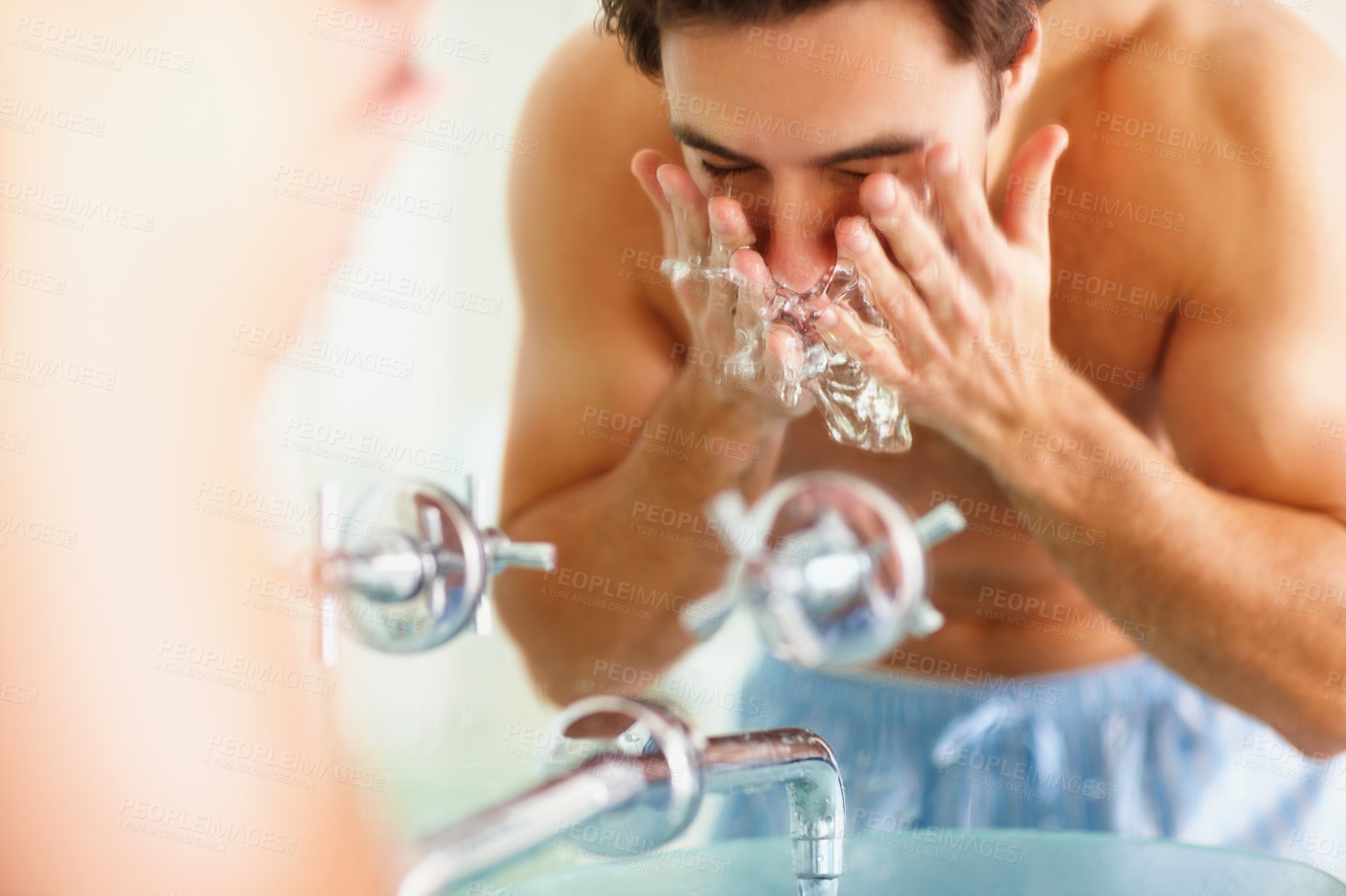 Buy stock photo Man, face and water for rinsing in bathroom for germs, bacteria and facial hygiene. Male person, hands and sink for dermatology, skincare or morning routine with soap for grooming, health or wellness