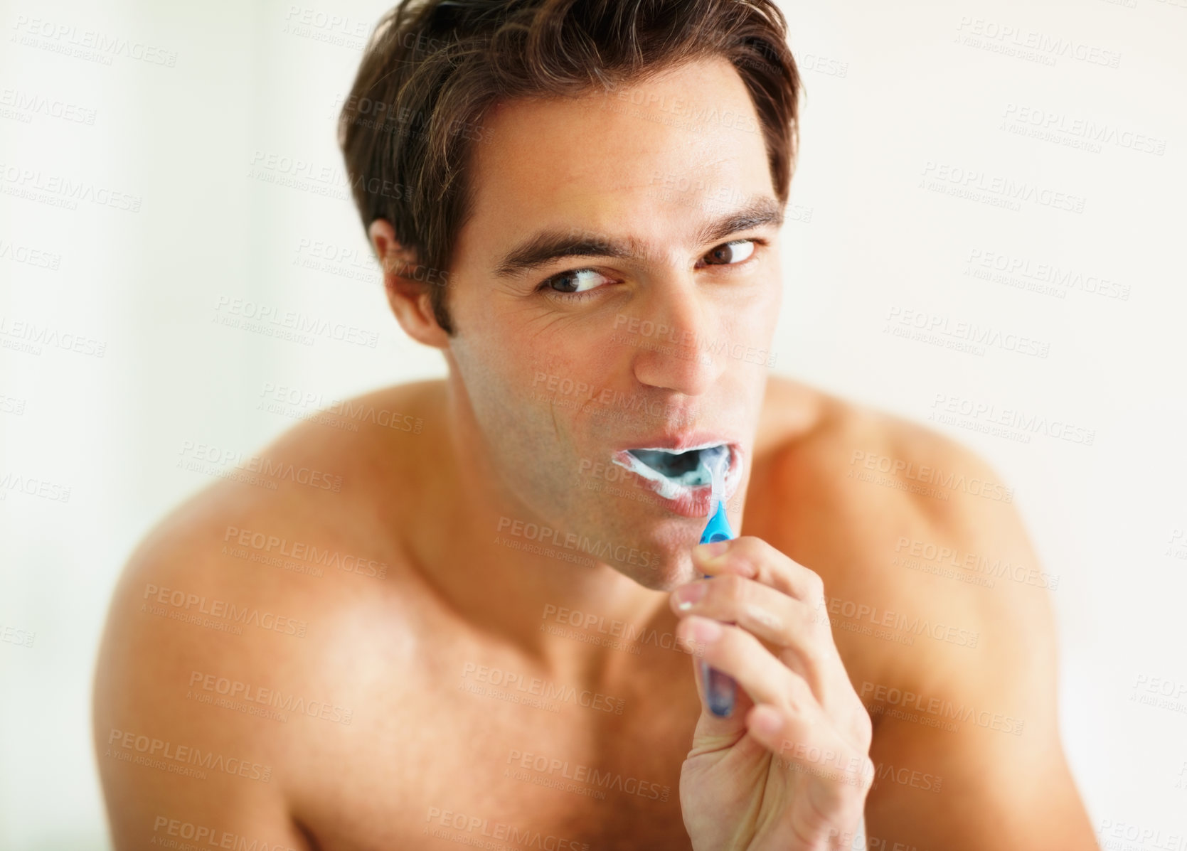 Buy stock photo Bathroom, brushing teeth and man with dental hygiene, wellness and grooming routine for fresh breath. Person, home or guy with toothbrush, cleaning his mouth and morning with oral health or self care