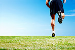 Young guy jogging against the sky - Outdoor