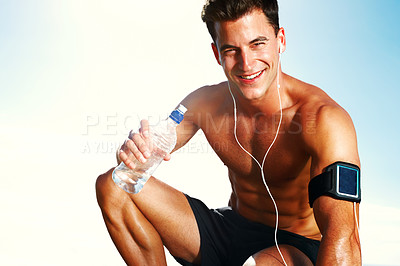 Buy stock photo Closeup of a happy young guy drinking water against the sky - Copyspace
