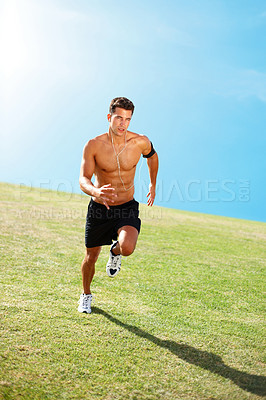 Buy stock photo Portrait of a fit young man running against the sky - Copyspace
