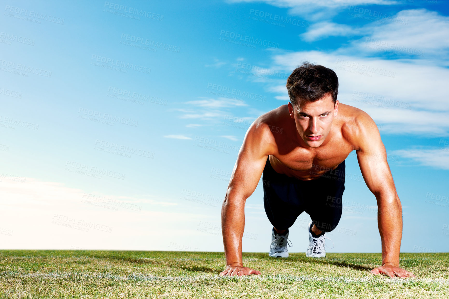 Buy stock photo Young, man and lawn with push ups for fitness training, blue sky with sun for exercise. Male athlete, grass and strong body with arms for growth, shirtless workout with hands in summer for wellness