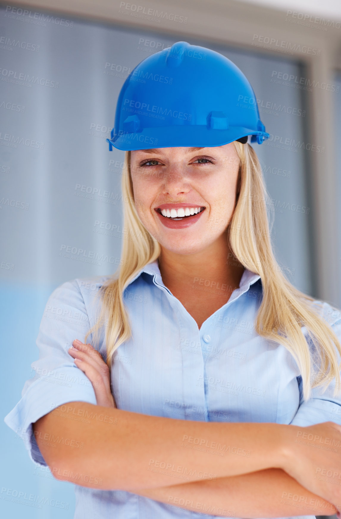 Buy stock photo Architecture, portrait of happy woman with confidence and helmet for safety on construction site. Civil engineering, project management and property development, female contractor with arms crossed.