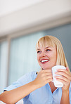 Happy business woman with coffee cup