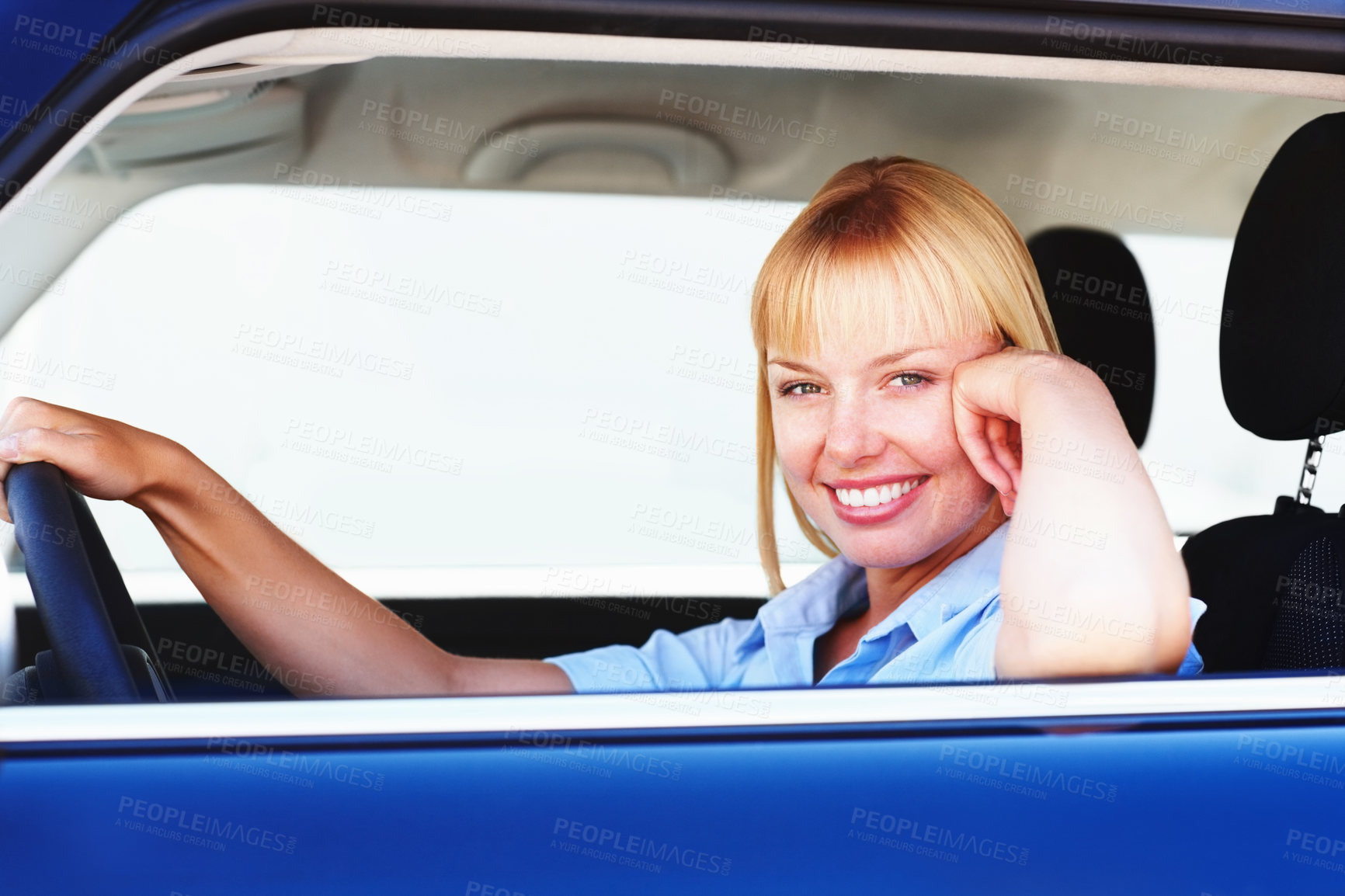Buy stock photo Smiling blond woman in a car sitting at the driver's seat