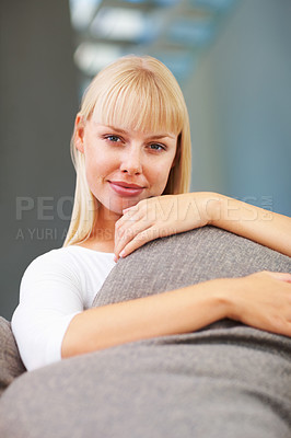 Buy stock photo Woman, portrait and pillow for hug, comfort and lounge for relaxation in home or apartment. Homeowner, cushion and house with couch, smile and living room rest for break on sofa embracing furniture