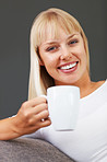 Woman smiling with coffee cup