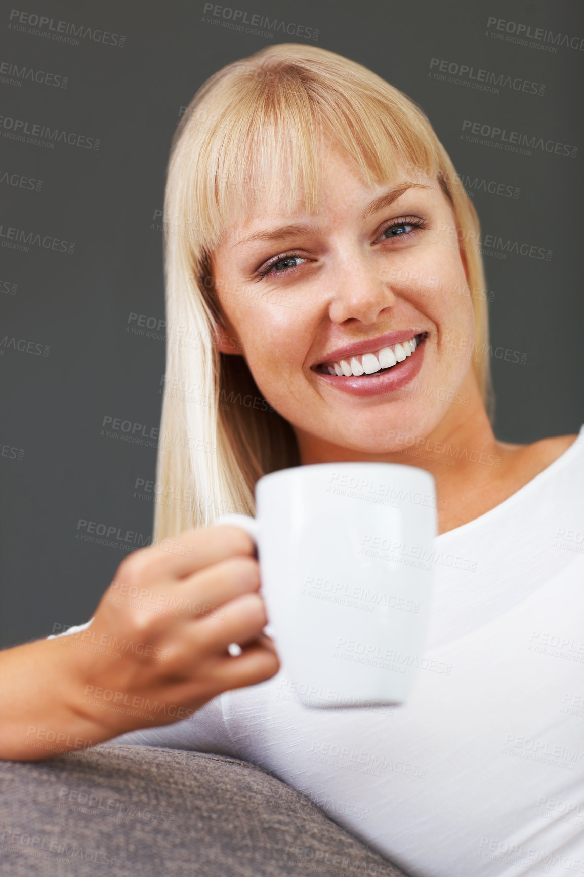 Buy stock photo Portrait, coffee and woman on sofa with mug for happiness, relax or morning routine in living room. Smile, drink and person with hot beverage for enjoyment, stress relief or weekend break in home