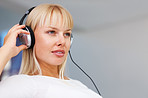 Woman listening music while looking away