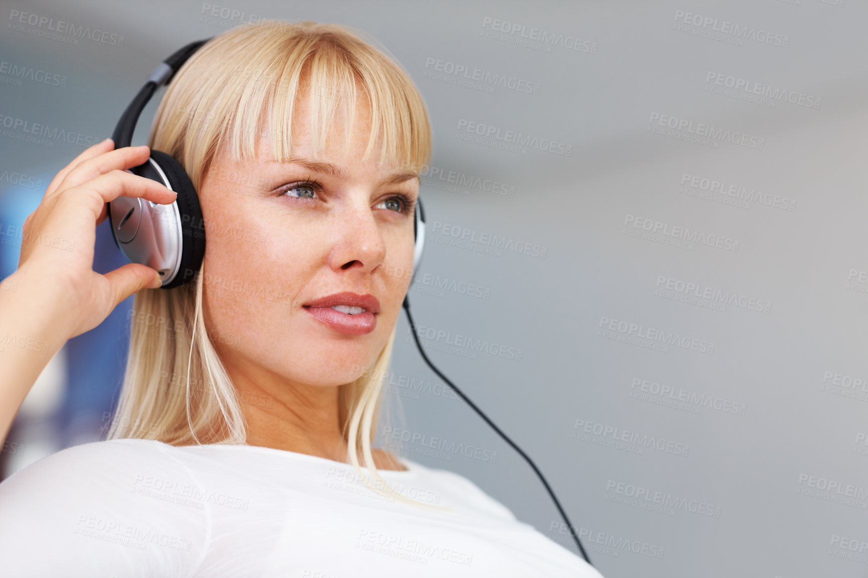 Buy stock photo Headphones, music and thinking with woman on sofa in living room of home to relax for weekend time off. Radio, streaming and idea with serious person listening to audio playlist or sound in apartment